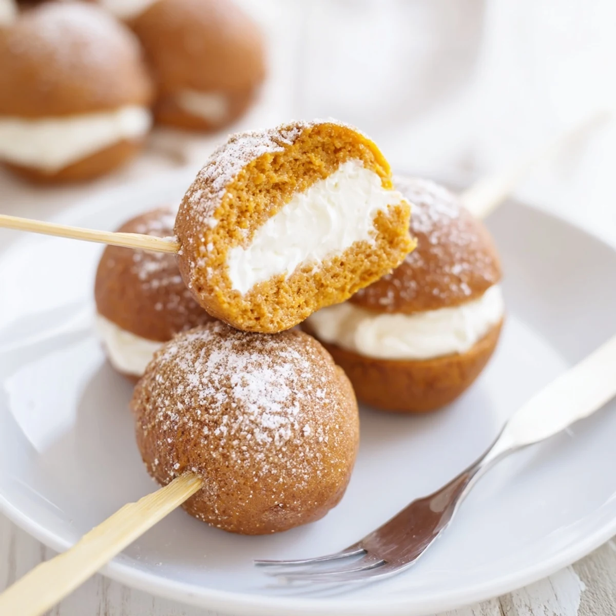 Delicious sweet potato muffin skewers drizzled with icing, ideal for party snacks.