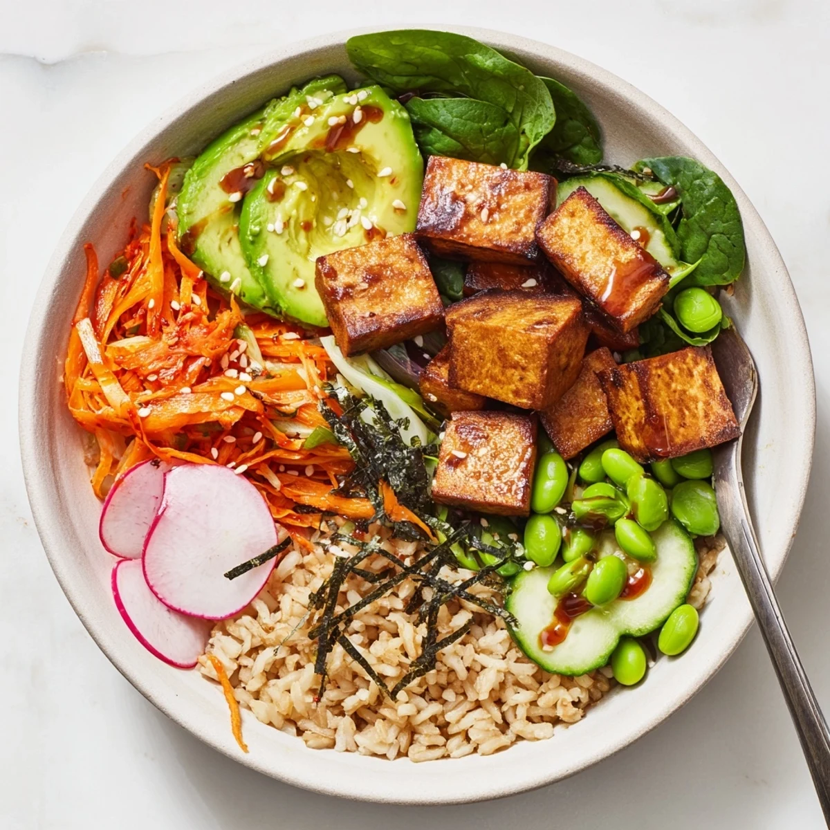 Delicious fermented vegetable bowl with hearty grains and creamy avocado slices.  