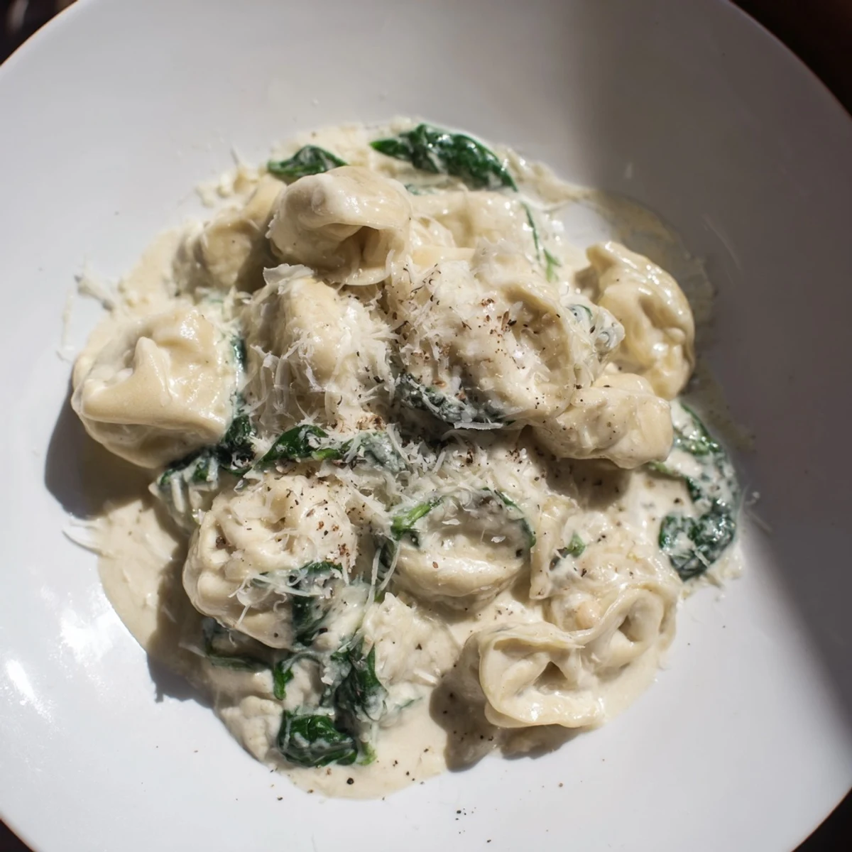This delicious Creamy Spinach Alfredo Tortellini recipe features a glistening, creamy sauce ladled over pasta.