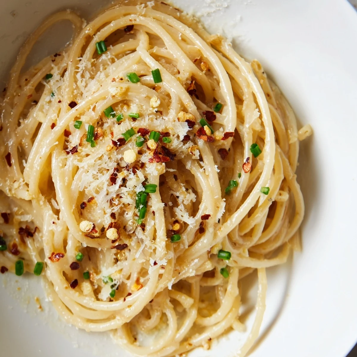 Close-up of creamy Miso Butter Pasta: a visually appealing blend of pasta, cheese, and flavorful sauce.