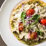 Freshly assembled Pesto Chicken Flatbread with vibrant pesto, waiting to be baked until golden.