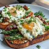 Asparagus and Egg Tartines: vibrant open-faced sandwiches with creamy eggs, tender asparagus, and fresh chives on rustic bread.