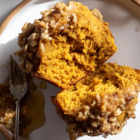 Fluffy Maple Ginger Spicy Pumpkin Biscuit Muffins topped with crunchy pecans and syrup.  