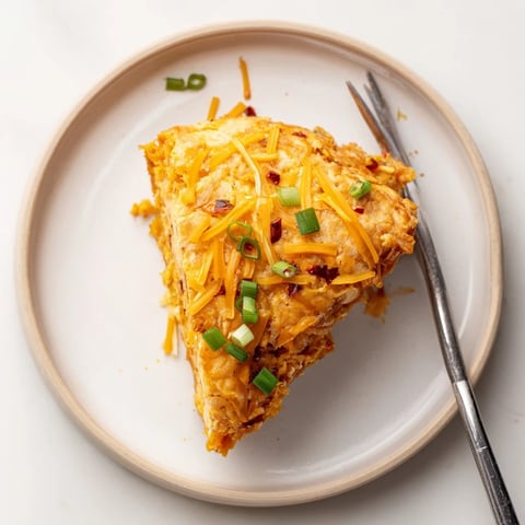 Fluffy chili garlic pumpkin pancake scones golden brown and garnished with fresh chives.  