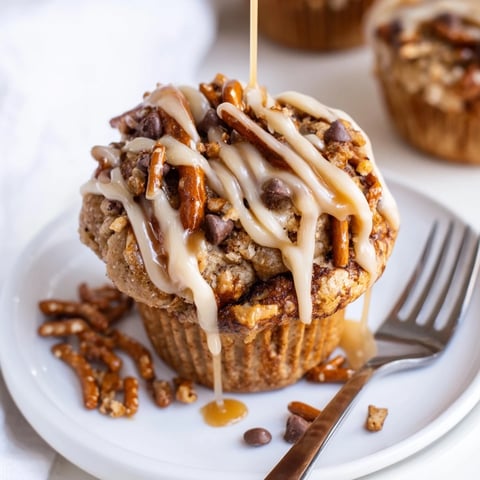 Fluffy Maple Bourbon Cinnamon Pretzel Pancake Muffins drizzled with sweet maple glaze.  