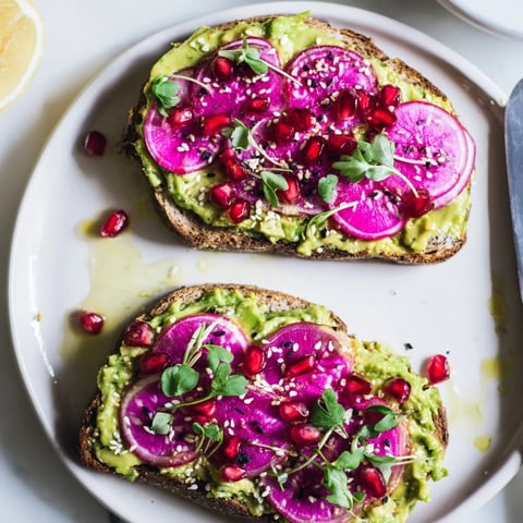 Vibrant Bright & Bold Breakfast Toasts topped with creamy ube and fresh avocado slices.