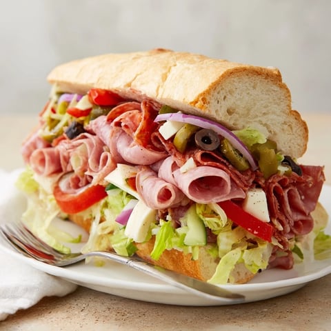 Vibrant Flavor Mash-Up Sandwiches stacked with Italian meats and fresh veggies.  