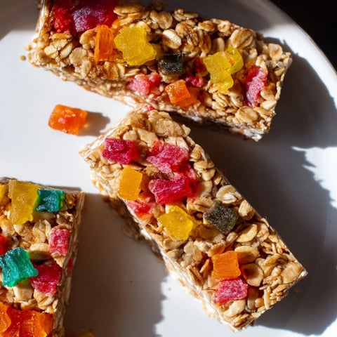 Colorful DIY snack bars topped with fruity gummies and freeze-dried candies  