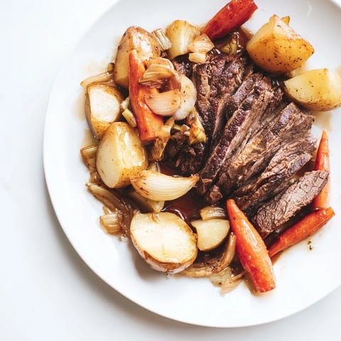 Juicy Sunday Pot Roast with tender vegetables, in a rich, flavorful broth, perfect comfort food.