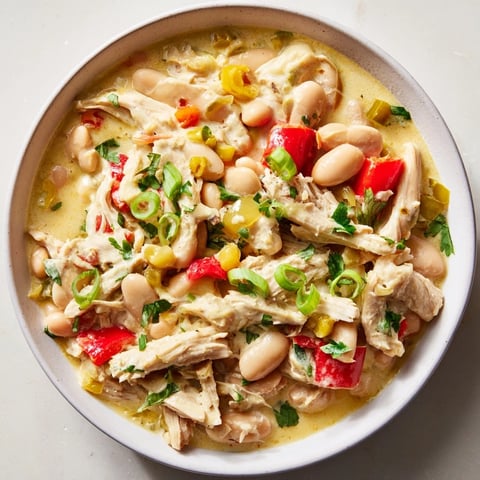 Creamy white chicken chili with beans, a hearty and flavorful chili with tender chicken and creamy goodness.