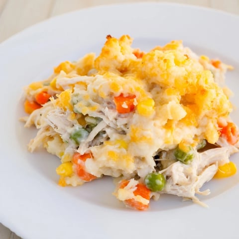 Golden, cheesy cheddar biscuits top a savory One-Pan Chicken Cobbler, perfect for a cozy dinner.