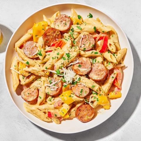 Cajun Spiced Smoked Sausage Alfredo: creamy pasta with sausage, peppers, and a rich, flavorful sauce.
