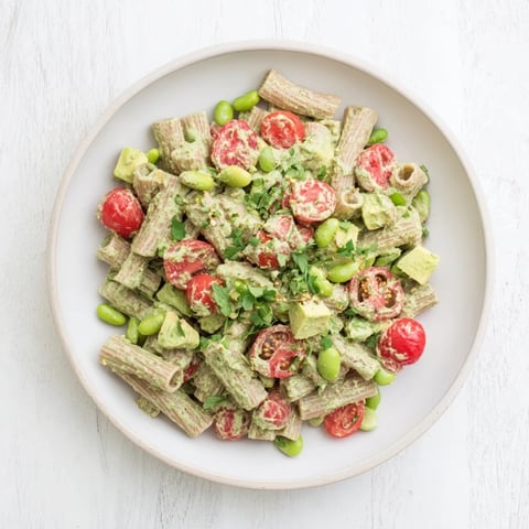 Vibrant Holiday Glow Green Goddess Protein Pasta Salad, featuring creamy dressing and fresh veggies, ready to eat.