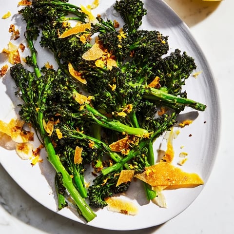 Air-fried Charred Broccolini Salad with crispy garlic and shaved Parmesan, a delicious side dish.
