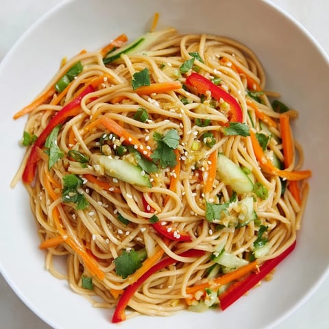 Garlic Noodle Salad: a colorful mix of noodles and veggies, tossed in a savory, aromatic sauce.