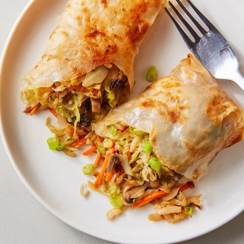 Golden-brown crispy rice paper dumplings, filled with savory vegetables, ready for dipping and enjoy.