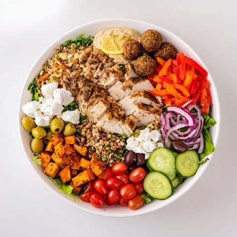 Guests enjoying the interactive build-your-own bowls filled with vibrant ingredients and sauces.  
