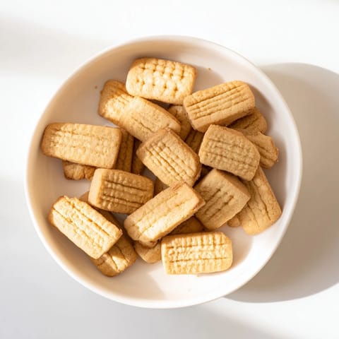 A close-up of freshly baked classic shortbread cookies with a delicate, crumbly texture, ready to enjoy.
