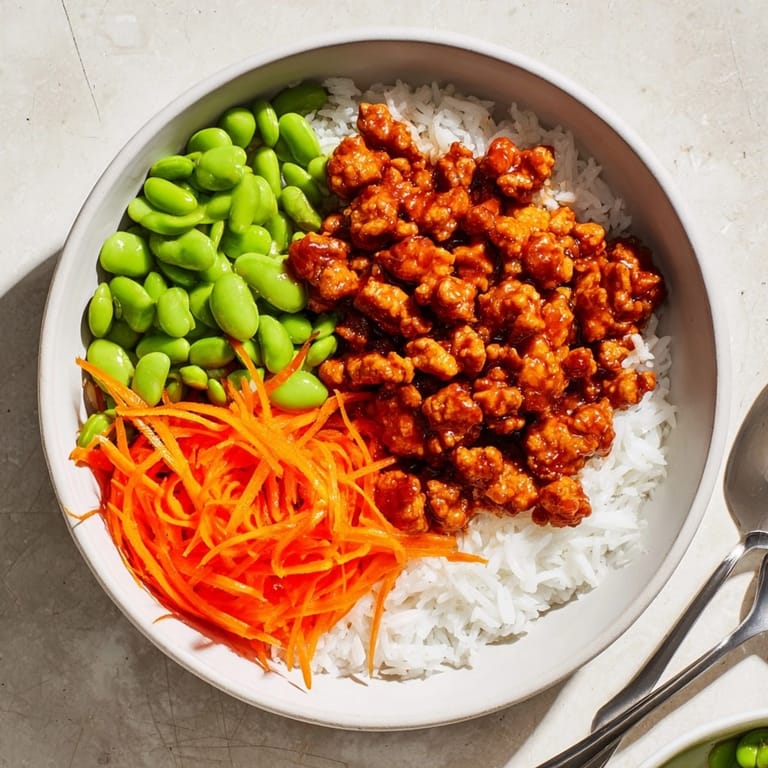 Homemade Teriyaki Turkey Bowls with bright edamame and fresh, crisp carrots.