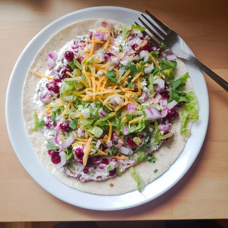 Hearty tacos filled with creamy cranberry jalapeño dip and melted cheese goodness.  
