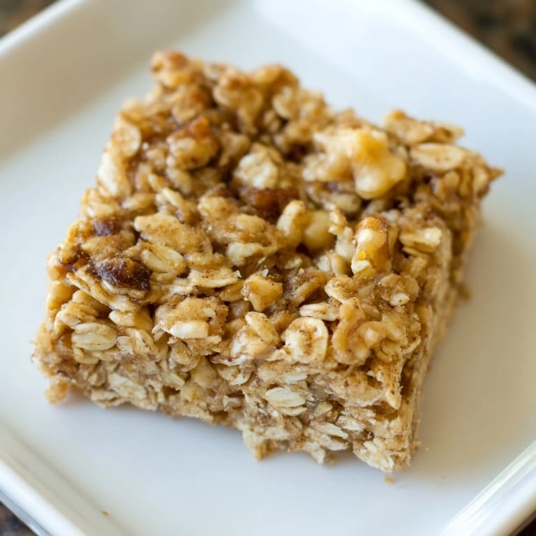 Warm, cinnamon-infused Maple Cinnamon Oatmeal Bars; imagine their aroma as they bake in the oven.