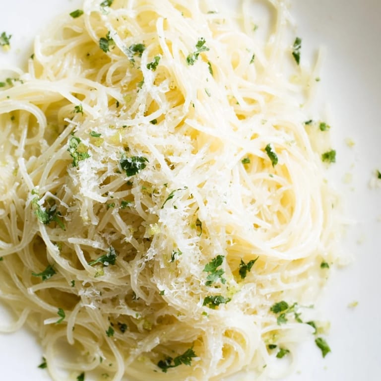 Quick 20-minute Lemon Butter Pasta Light recipe plated with a sprinkle of black pepper, ready for a light vegetarian dinner.