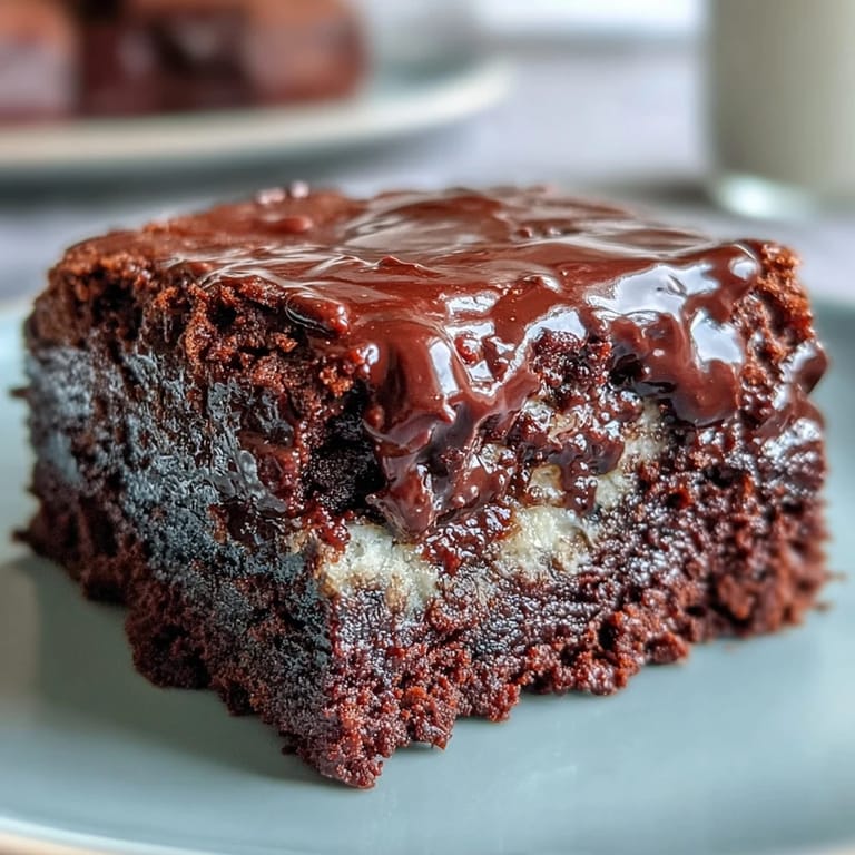 Fudgy triple chocolate brownies with a sourdough tang, deep espresso notes, and a glossy, crackly top.  