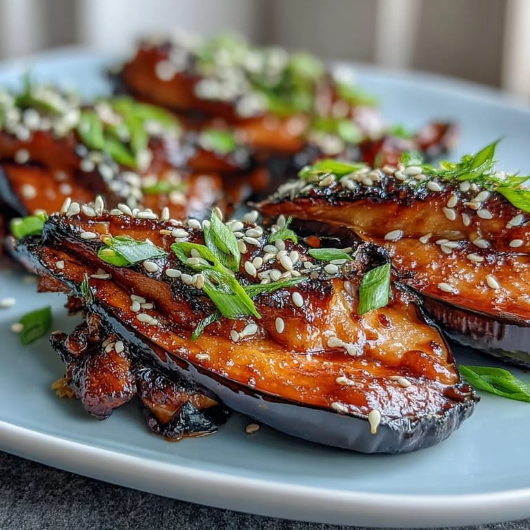 Close-up of Miso Glazed Eggplant, topped with sesame seeds, ready to serve.