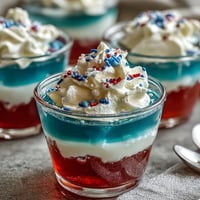 Fruity 4th of July Firecracker Jello Shots (Alcohol-Free) ready for festive red, white, and blue enjoyment.
